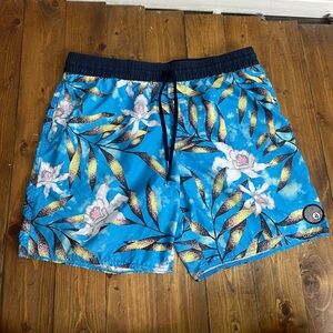 Volcom size medium unlined swim trunks blue floral